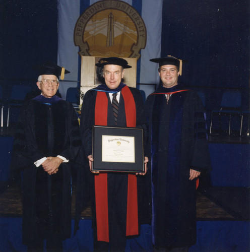 William Leonhard, Thomas Everhart, holding his award, and President Davenport