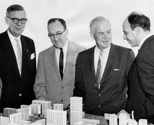 Company officials with model of Century City