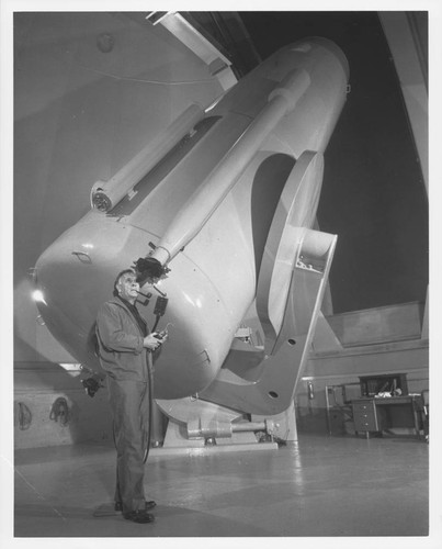 Edwin Powell Hubble at the guidescope of the 48-inch Schmidt camera, Palomar Observatory