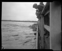 Los Angeles River from the Main Street Bridge during rainstorm flooding, Los Angeles, 1927