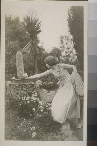 [Woman posing with rose]