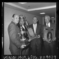 Buzzie Bavasi, Gene Autry and Rod Dedeaux with Shriner Mark T. Gates in Los Angeles, Calif., 1964