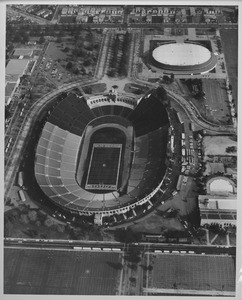 Aerial photo facing east over the Coliseum and Sports Arena in Exposition Park
