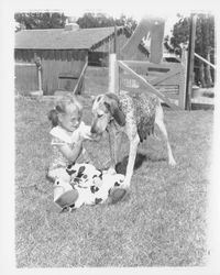 Marsha Karns with Echo and her English coon dog puppies, Petaluma, California, 1955