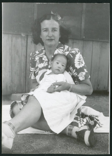 Photograph of Irene Gavigan holding an infant at Manzanar