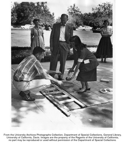 Numbers for the year 1955 are placed in cement in front of the Library/Administration building