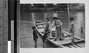 Maryknoll Sister standing on a boat, Kaying, China, ca.1920-1940