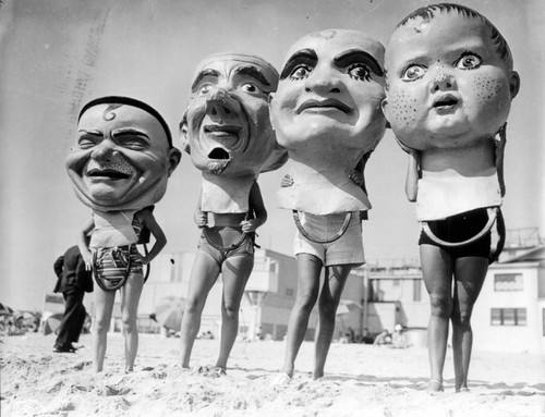 Giant Mardi Gras figures pose