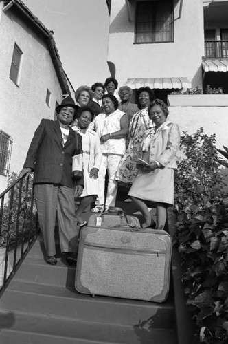 Cliquetts Social Club members posing together on steps, Los Angeles, 1987