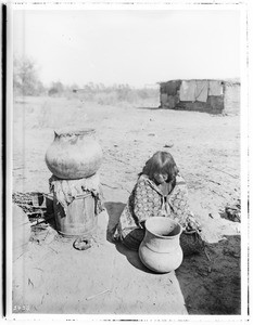 A Yuma Indian woman pottery maker making "ollas", ca.1900