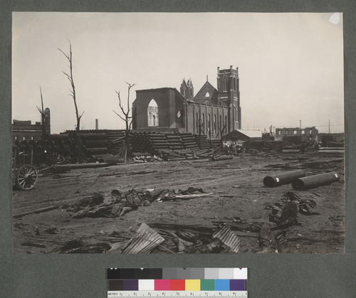 [New pipe stockpiled near ruins of church. Unidentified location.]