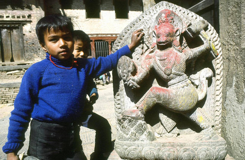 Children with Hanuman sculpture