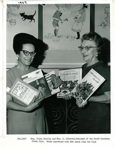 Viola Sirolos and Mrs. I. Albrecht with Book Purchase