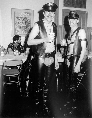 Two leather men drinking and socializing