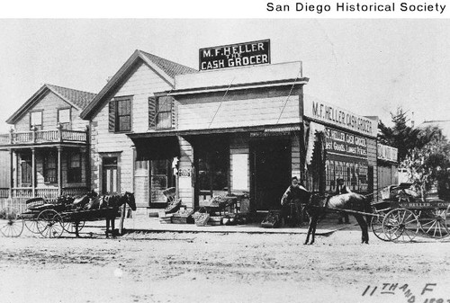 Horse-drawn carts outside the M.F. Heller grocery store at Eleventh and F Street