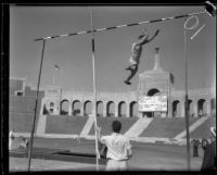 Stanford vaulter leaps over the bar during a pole-vault attempt during the S.C. and Stanford dual track meet, Los Angeles, 1934