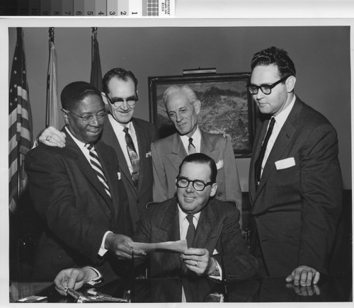 Chairman George A. Beavers, Jr. presents to Mayor Norris Poulson check in the amount of $251,043.26 as payment in lieu of taxes for the 1953-54 and 1955 fiscal years