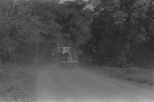 Men travelling on a truck, San Basilio de Palenque, 1976