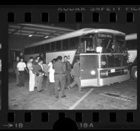 Illegal aliens boarding U.S. Border Patrol bus in Los Angeles, Calif., 1977
