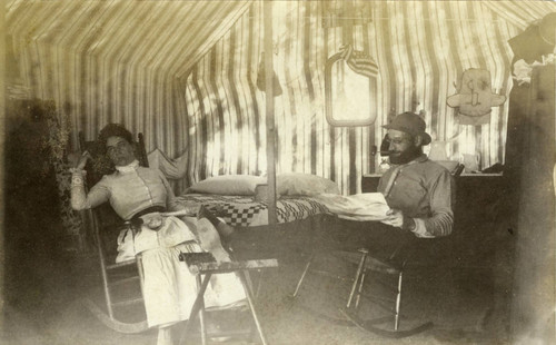 Visitors in a tent cabin at the Blithedale Hotel, Mill Valley, circa 1889 [photograph]