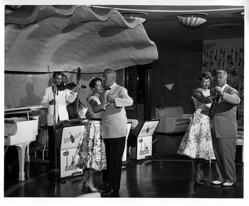 "2 couples dancing. P.C. 51 HVW 9/54"