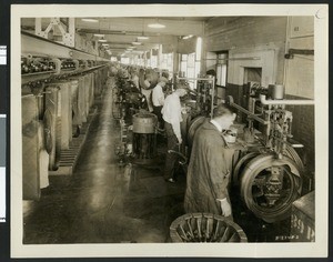 Line of workers inside the Firestone Rubber Company, ca.1928