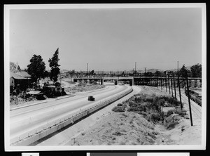 Road and railroad tracks passing under a grade separation, 1930-1949