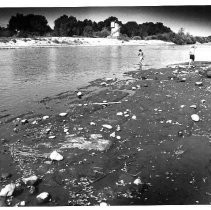Playing on American River shoreline