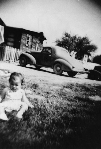 Mexican American child in front yard