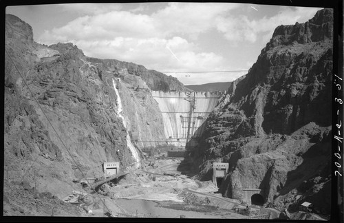 Downstream view of Boulder dam; diversion tunnel and lower coffer dam in foreground
