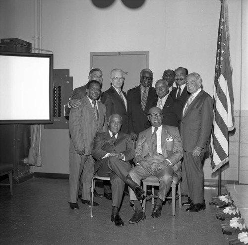 Gilbert Lindsay, Col. Leon H. Washington, Jr., and Dr. H. Claude Hudson posing with others at the new Kearny Post Office opening, Los Angeles, 1972