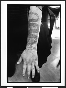 Tattooed male forearm, Caracen Health Center, Saint Peter's Convent, San Francisco, California, 2002
