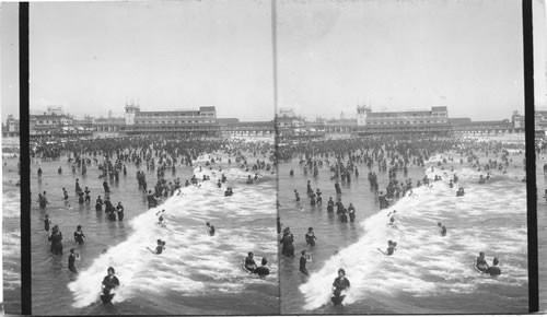 Crowded in surf at Atlantic City, looking N. from steel pier, N.J