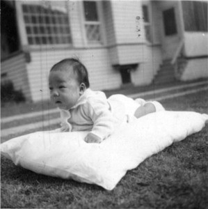 baby on pillow, outside
