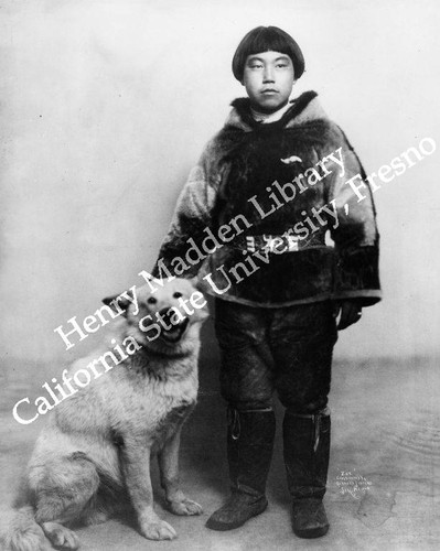 Eskimo boy with dog