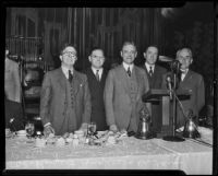 Rupert Hughes, Dr. F. Fern Petty, Dr. J. Whitcomb Brougher, Sr., Frank Weller, and Dr. Robert Millikan discuss Community Chest funds, Los Angeles, 1935