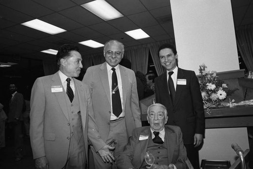 Dr. H. Claude Hudson posing with others at his 98th birthday celebration, Los Angeles, 1984
