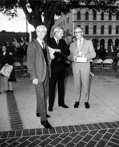 Owen Brady standing with two men in the Plaza