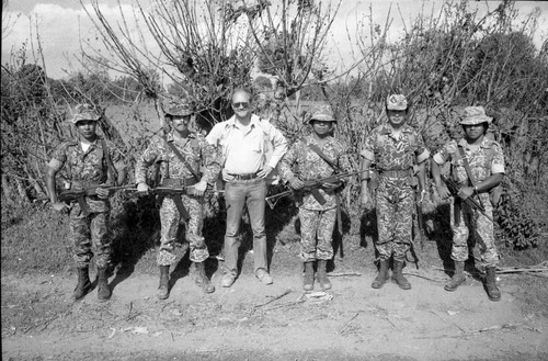 Unidentified man with group of soldiers, Guatemala, 1982
