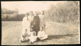 Photograph of Genay family with friends