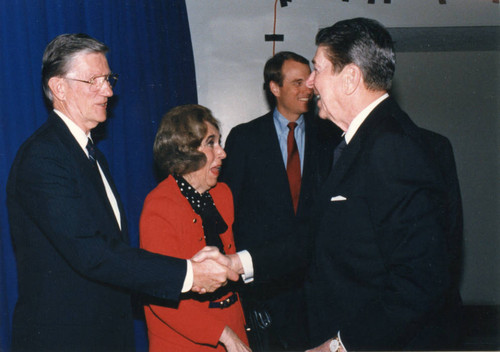 President Reagan shaking hands with Chancellor Runnels, Mrs. Brock and Regent Chair Tom Bost on the R