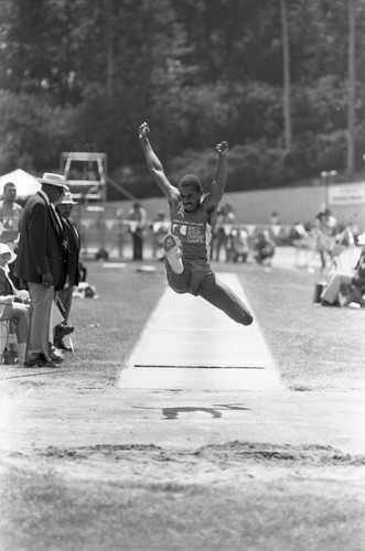 Athlete completing a long jump, Los Angeles, 1982