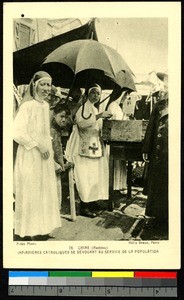 Missionary nurses hold street clinic, China, ca.1920-1940