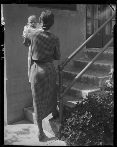 Woman holding baby, Los Angeles, circa 1935