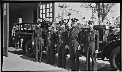 Crew stands with Ahrens Fox in front of Station No. 6, 1st Street and Ontario Ave