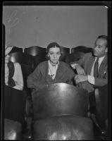 Actress ZaSu Pitts seated in an auditorium or courtroom, Los Angeles, 1930-1939