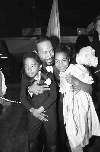 Marvin Gaye hugging his children at the 25th Annual Grammy Awards, Los Angeles, 1983