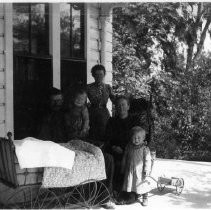 A family posing on porch