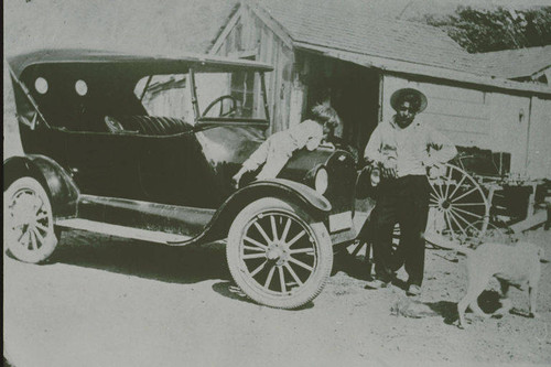Little Angie Marquez (on the hood of the car) with an unidentified person in Santa Monica Canyon