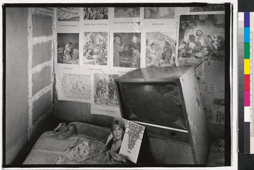 [Home interior with pictures of the story of Jesus on the wall, Oakland, California.]